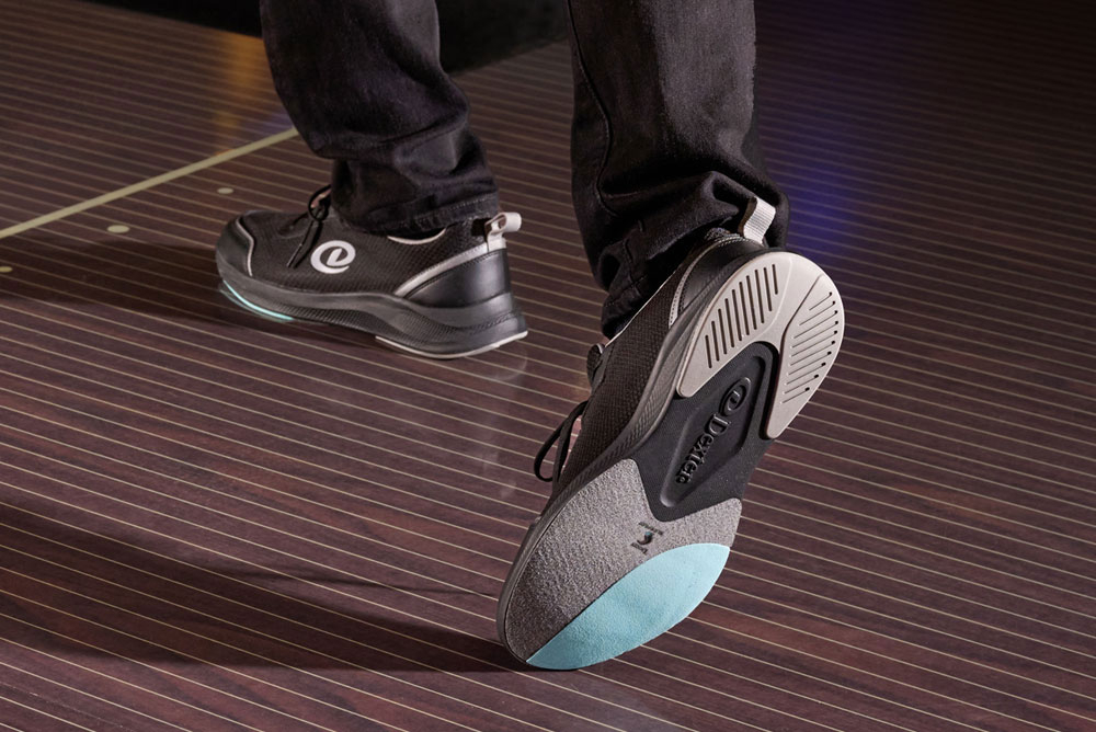 A man bowling while wearing the Dexter Pilot Pro bowling shoe.