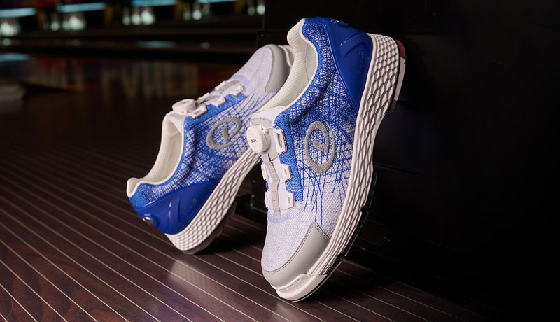 The T.H.E 9 Techknit in Blue/White on a brown wood floor.